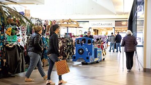 Mike Randall driving the Big Blue Express train through the University Mall