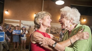 Democratic gubernatorial nominee Sue Minter embraces former governor Madeleine Kunin Tuesday night in Burlington.