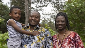 Champlain Housing Trust board member Issouf Ouattara with his wife and son