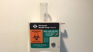 A needle disposal box in the men’s room at Burlington City Hall