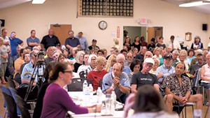 Rutland residents hear about refugee resettlement plans last May at a meeting of the Board of Aldermen.