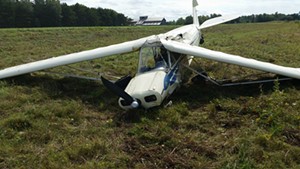 The crashed Piper PA-11 on the Savage Island runway