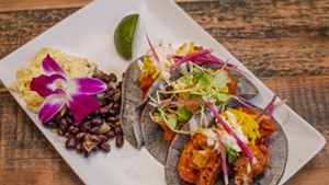 Buffalo cauliflower tacos with turmeric slaw and blue cheese crema at Revolution Kitchen