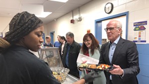 Sen. Peter Welch (right) in the lunch line at St. Albans City School during the listening tour
