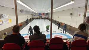 A lounge-side view of "beer league" curling action at the Bedford Curling Club