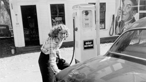 Alice Smith (then Alice Goulet) pumping gas at Goulet's Garage in Washington in 1956