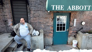 Former hotel resident Michael Hutchins outside the Brattleboro building where he lives