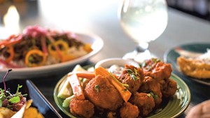 An array of dishes at Despacito Bar and Kitchen, including Buffalo cauliflower