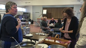Bethany United Church of Christ volunteer Susanna Griefen serving food at a weekly community lunch