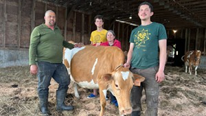Earl Ransom with his wife Amy Huyffer and their sons Harley & Jackson Ransom with Pomegranate the cow