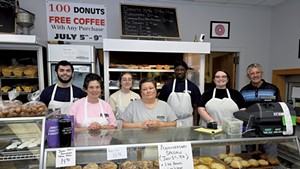 Owners Lynn (in pink) and Walt Manney (far right) with Jones' Donuts staff