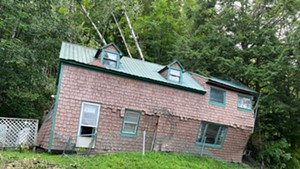 The Masons' Barre home after the slide