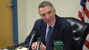Governor-elect Phil Scott speaks to reporters Monday in Montpelier.