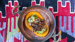 Lamb and cabbage sarma with sweet potato purée and crispy hen-of-the-woods mushrooms
