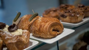 Ham-and-cheese croissants speared with cornichons at Boxcar Bakery