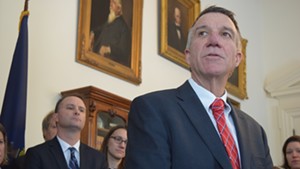 Gov. Phil Scott speaks Thursday about a bill to defy President Donald Trump’s immigration order as Attorney General T.J. Donovan and others listen.