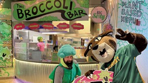 Gabe "the Broccoli Man" Marcolini (left) with the UVM mascot