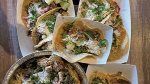 Assorted tacos and nachos at Caja Taqueria