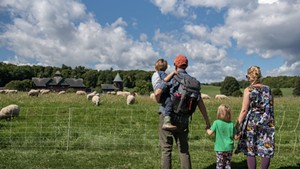 A family on a walking trail at Shelburne Farms