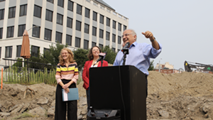 Champlain Housing Trust CEO Michael Monte (right) with Evernorth president Nancy Owens and Burlington Mayor Emma Mulvaney-Stanak