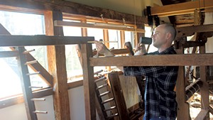 Justin Squizzero dismantling a loom