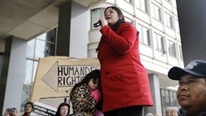 Lymarie Deida holds her daughter, Solmarie Carrillo, as she speaks about her husband, Alex Carrillo, at a rally outside a Boston court on Monday.