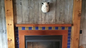 The fireplace at Shepherds Pub in Waitsfield