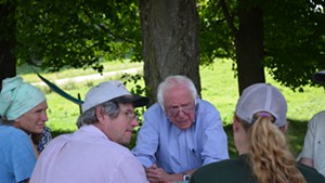 Sen. Bernie Sanders talks with dairy farmers in East Fairfield.