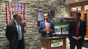 Tom Cheney, director of 70x2025vt, is flanked by Gov. Phil Scott (left) and Vermont Student Assistance Corporation president Scott Giles on Tuesday.