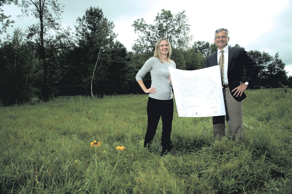 Amy Cooper and Dr. Tom Dowhan at the  site of the proposed surgical center - MATTHEW THORSEN