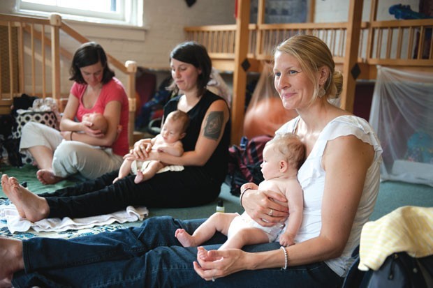 Moms and babes at an infant-massage class