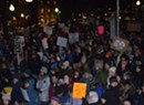 Hundreds Brave Cold to Protest Trump at Burlington Rally
