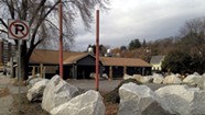 What's Up With the Boulders Surrounding a Defunct Barre Business?