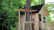 A Backyard Tree House With Zip Line and Hammock