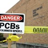 Signs warning about PCBs at Burlington High School