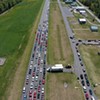 Cars line up to get food during a Farmers to Families Food Box drop last year