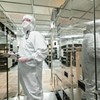 A GlobalFoundries employee working on the production floor in Essex Junction