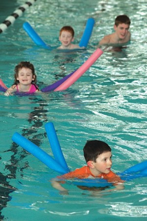 MATTHEW THORSEN - Swim students practice their paddling at a Learning Pool class