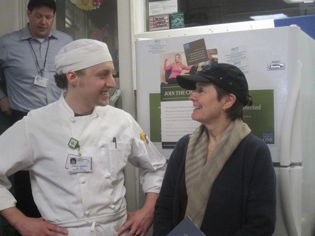 Waters (in a Fletcher Allen hat) with line chef Curtis Campbell