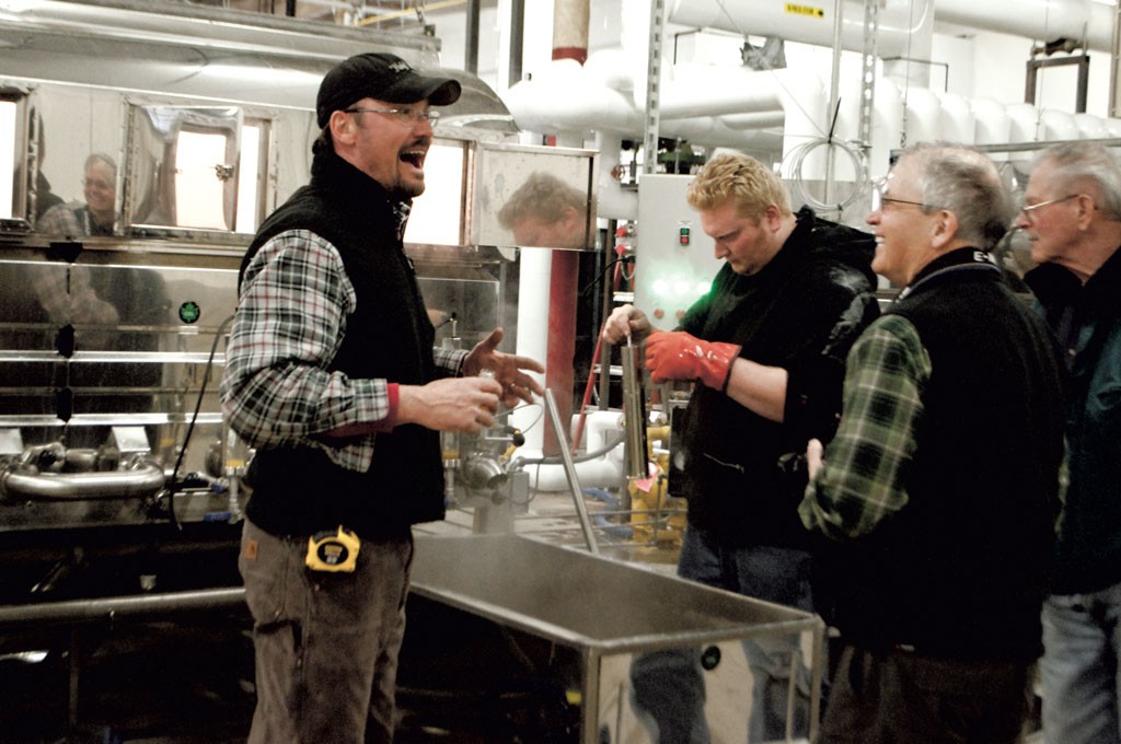Workers monitor and test the syrup at Sweet Tree's Island Pond plant - HANNAH PALMER EGAN